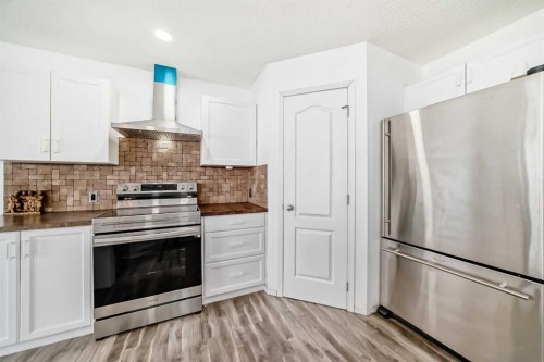 120 Springmere Grove, Chestermere, AB - Indoor Photo Showing Kitchen With Stainless Steel Kitchen