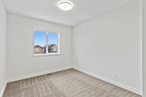 128 Fireside Way, Cochrane, AB - Indoor Photo Showing Other Room