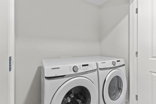 128 Fireside Way, Cochrane, AB - Indoor Photo Showing Laundry Room