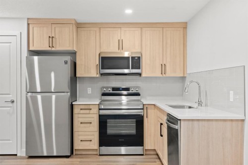 128 Fireside Way, Cochrane, AB - Indoor Photo Showing Kitchen