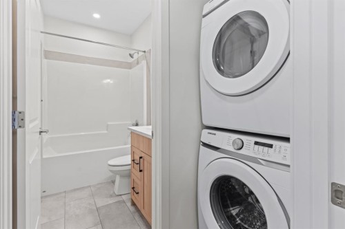 128 Fireside Way, Cochrane, AB - Indoor Photo Showing Laundry Room