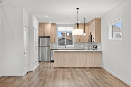 128 Fireside Way, Cochrane, AB - Indoor Photo Showing Kitchen