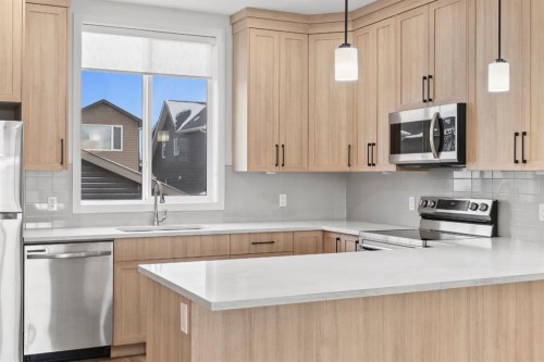 128 Fireside Way, Cochrane, AB - Indoor Photo Showing Kitchen