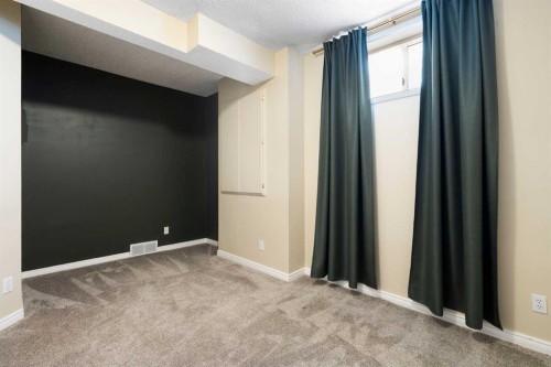15 Mt Norquay Gate Se, Calgary, AB - Indoor Photo Showing Other Room