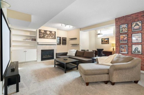 15 Mt Norquay Gate Se, Calgary, AB - Indoor Photo Showing Living Room With Fireplace