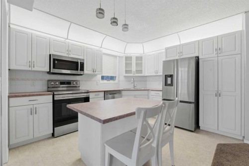 358-8535 Bonaventure Drive Se, Calgary, AB - Indoor Photo Showing Kitchen With Stainless Steel Kitchen