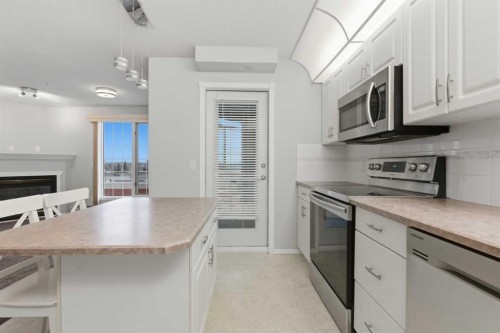358-8535 Bonaventure Drive Se, Calgary, AB - Indoor Photo Showing Kitchen With Upgraded Kitchen