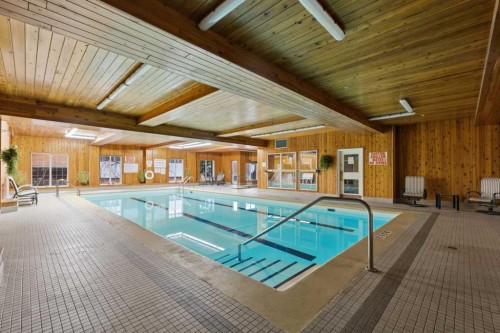 358-8535 Bonaventure Drive Se, Calgary, AB - Indoor Photo Showing Other Room With In Ground Pool