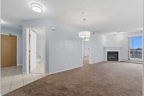 358-8535 Bonaventure Drive Se, Calgary, AB - Indoor With Fireplace