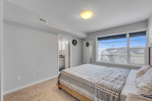 425 Saddlemont Boulevard Ne, Calgary, AB - Indoor Photo Showing Bedroom