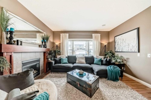 266 Copperstone Circle Se, Calgary, AB - Indoor Photo Showing Living Room With Fireplace