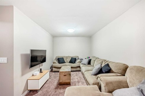 266 Copperstone Circle Se, Calgary, AB - Indoor Photo Showing Living Room