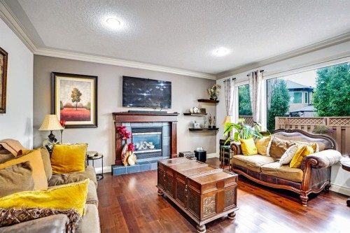 58 Evergreen Common Sw, Calgary, AB - Indoor Photo Showing Living Room With Fireplace