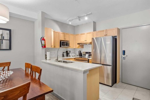 106-107 Montane Road, Canmore, AB - Indoor Photo Showing Kitchen With Double Sink