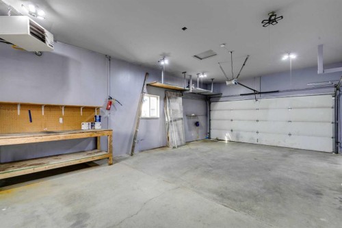 228 Luxstone Place Sw, Airdrie, AB - Indoor Photo Showing Garage