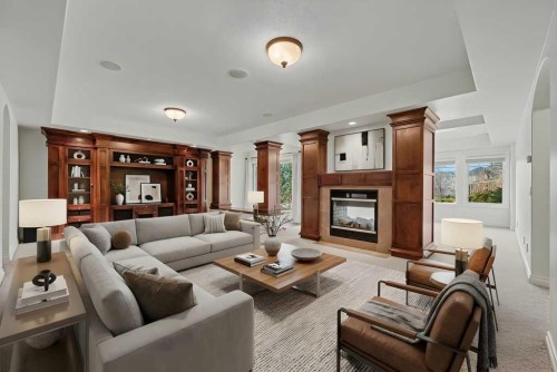 62 Discovery Vista Point Sw, Calgary, AB - Indoor Photo Showing Living Room With Fireplace