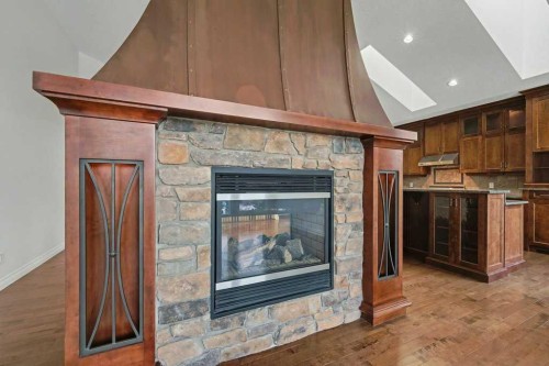 62 Discovery Vista Point Sw, Calgary, AB - Indoor Photo Showing Living Room With Fireplace