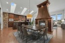 62 Discovery Vista Point Sw, Calgary, AB  - Indoor Photo Showing Dining Room With Fireplace 