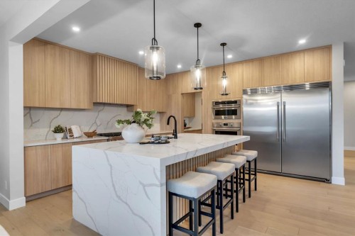 12 Spring Creek Point Sw, Calgary, AB - Indoor Photo Showing Kitchen With Upgraded Kitchen