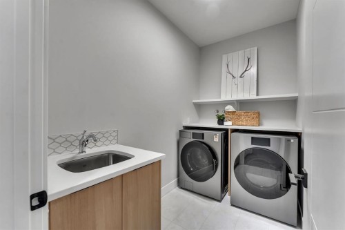 12 Spring Creek Point Sw, Calgary, AB - Indoor Photo Showing Laundry Room