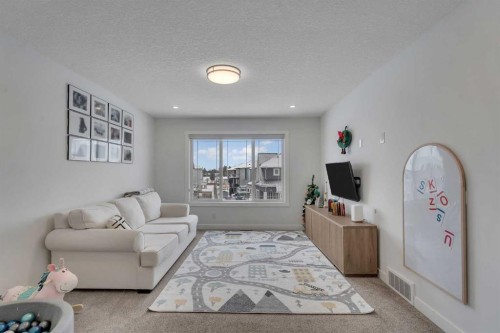 202 Kinniburgh Crescent, Chestermere, AB - Indoor Photo Showing Living Room