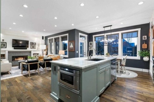 267 Coopers Hill Sw, Airdrie, AB - Indoor Photo Showing Kitchen With Fireplace