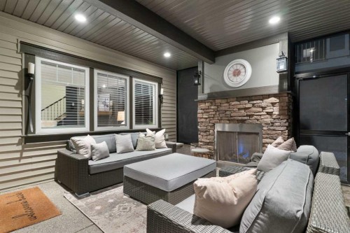 267 Coopers Hill Sw, Airdrie, AB - Outdoor With Fireplace With Deck Patio Veranda With Exterior