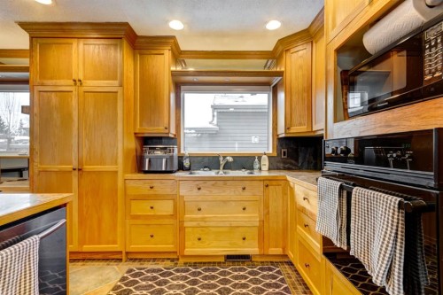 1408 106 Avenue Sw, Calgary, AB - Indoor Photo Showing Kitchen With Double Sink