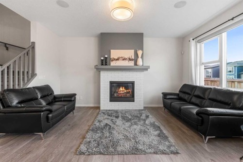 96 Belmont Terrace Sw, Calgary, AB - Indoor Photo Showing Living Room With Fireplace