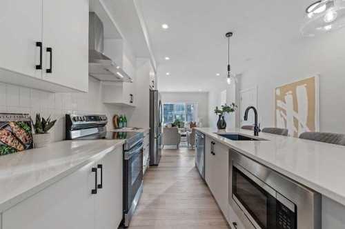 420 Fireside Drive, Cochrane, AB - Indoor Photo Showing Kitchen With Stainless Steel Kitchen With Upgraded Kitchen