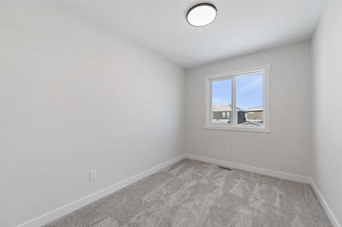420 Fireside Drive, Cochrane, AB - Indoor Photo Showing Other Room