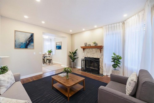 44 Macewan Ridge Close Nw, Calgary, AB - Indoor Photo Showing Living Room With Fireplace