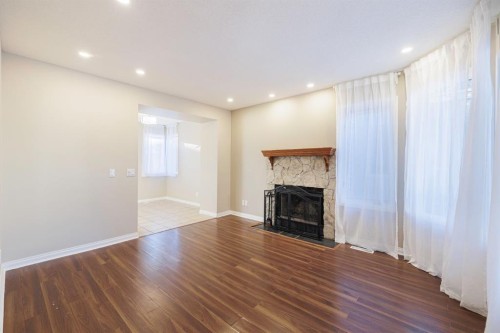 44 Macewan Ridge Close Nw, Calgary, AB - Indoor Photo Showing Other Room With Fireplace