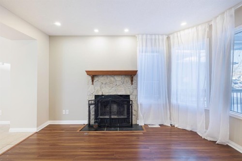 44 Macewan Ridge Close Nw, Calgary, AB - Indoor With Fireplace