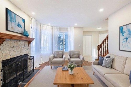 44 Macewan Ridge Close Nw, Calgary, AB - Indoor Photo Showing Living Room With Fireplace