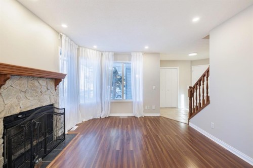 44 Macewan Ridge Close Nw, Calgary, AB - Indoor Photo Showing Other Room With Fireplace