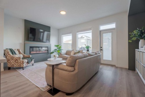 159 Belmont Crescent Sw, Calgary, AB - Indoor Photo Showing Living Room With Fireplace