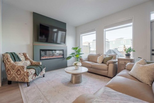 159 Belmont Crescent Sw, Calgary, AB - Indoor Photo Showing Living Room With Fireplace