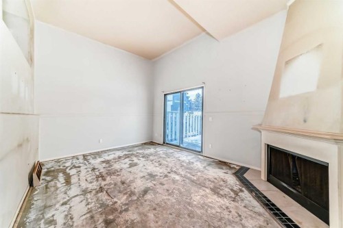 1802-919 38 Street Ne, Calgary, AB - Indoor Photo Showing Other Room With Fireplace