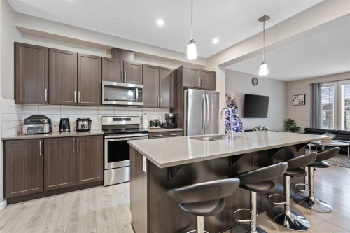 754 Belmont Drive Sw, Calgary, AB - Indoor Photo Showing Kitchen With Stainless Steel Kitchen With Double Sink With Upgraded Kitchen