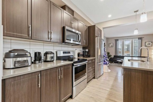 754 Belmont Drive Sw, Calgary, AB - Indoor Photo Showing Kitchen With Stainless Steel Kitchen With Double Sink With Upgraded Kitchen
