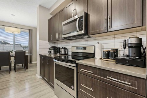 754 Belmont Drive Sw, Calgary, AB - Indoor Photo Showing Kitchen With Upgraded Kitchen