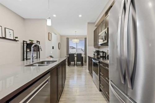 754 Belmont Drive Sw, Calgary, AB - Indoor Photo Showing Kitchen With Stainless Steel Kitchen With Double Sink With Upgraded Kitchen