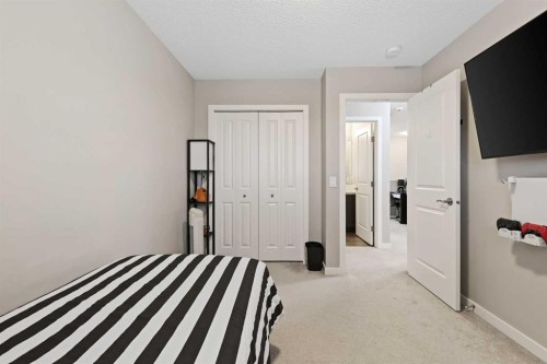 754 Belmont Drive Sw, Calgary, AB - Indoor Photo Showing Bedroom