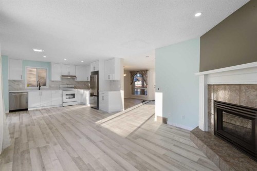 271 Coventry Green Ne, Calgary, AB - Indoor With Fireplace