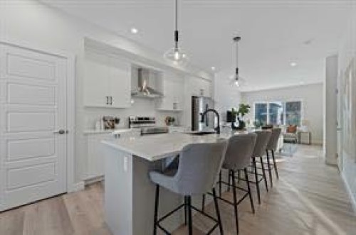 424 Fireside Drive, Cochrane, AB - Indoor Photo Showing Kitchen With Upgraded Kitchen