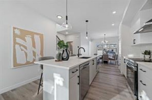 424 Fireside Drive, Cochrane, AB - Indoor Photo Showing Kitchen With Upgraded Kitchen