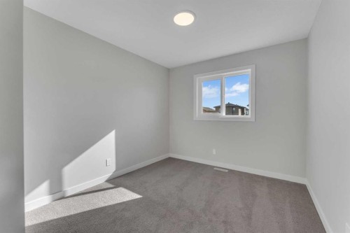 1205 Iron Ridge Avenue, Crossfield, AB - Indoor Photo Showing Other Room