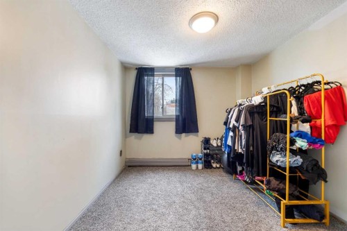 212-1411 7 Avenue Nw, Calgary, AB - Indoor Photo Showing Other Room