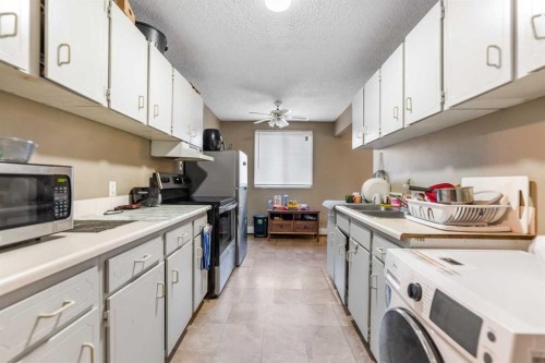204-4328 4 Street Nw, Calgary, AB - Indoor Photo Showing Kitchen With Double Sink